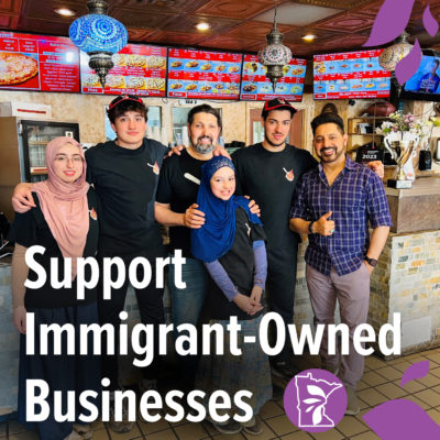 a group of people smiling with text overlay that reads "support immigrant-owned businesses"