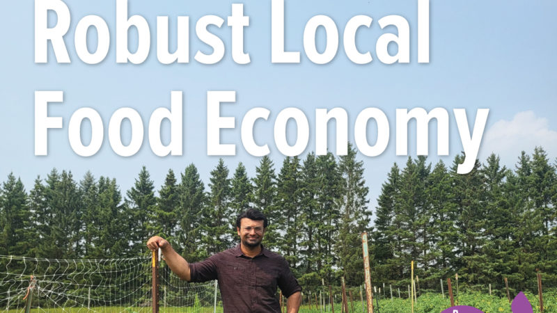 A person standing in an agricultural field with text overlay that reads "Cultivate a robust local food economy"