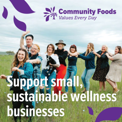 A photo of people standing in a field in a line with text overlay that reads "Support small, sustainable wellness businesses"