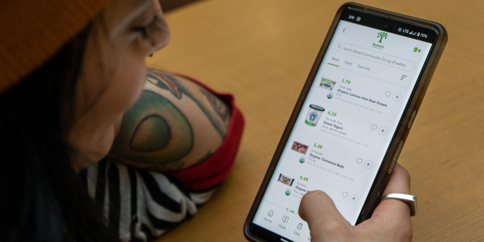 A person scrolling through the Co+op Deals app
