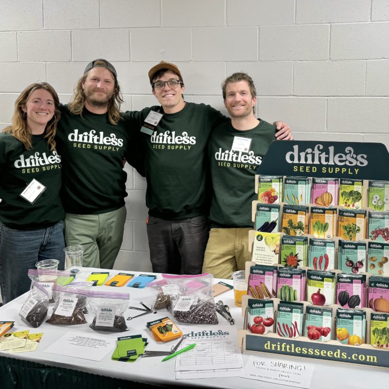 A photo of four people standing next to Driftless seeds