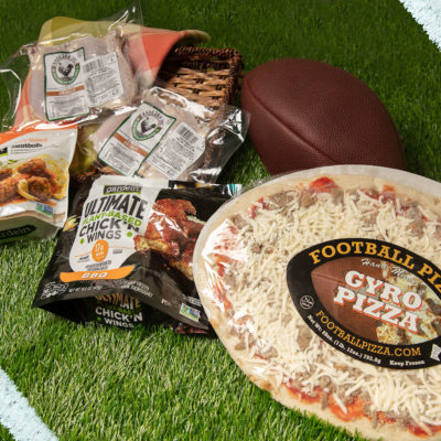 A collection of game day eats on a grass background