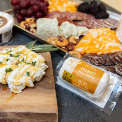 A close up of a charcuterie board with goat cheese