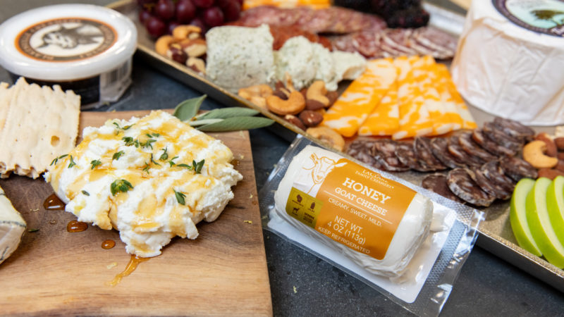 A close up of a charcuterie board with goat cheese