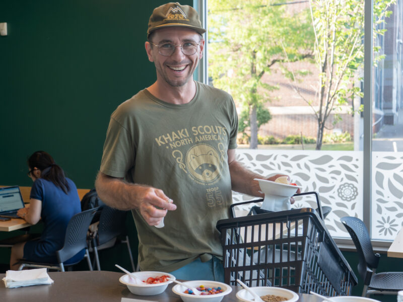 a person smiling over ice cream