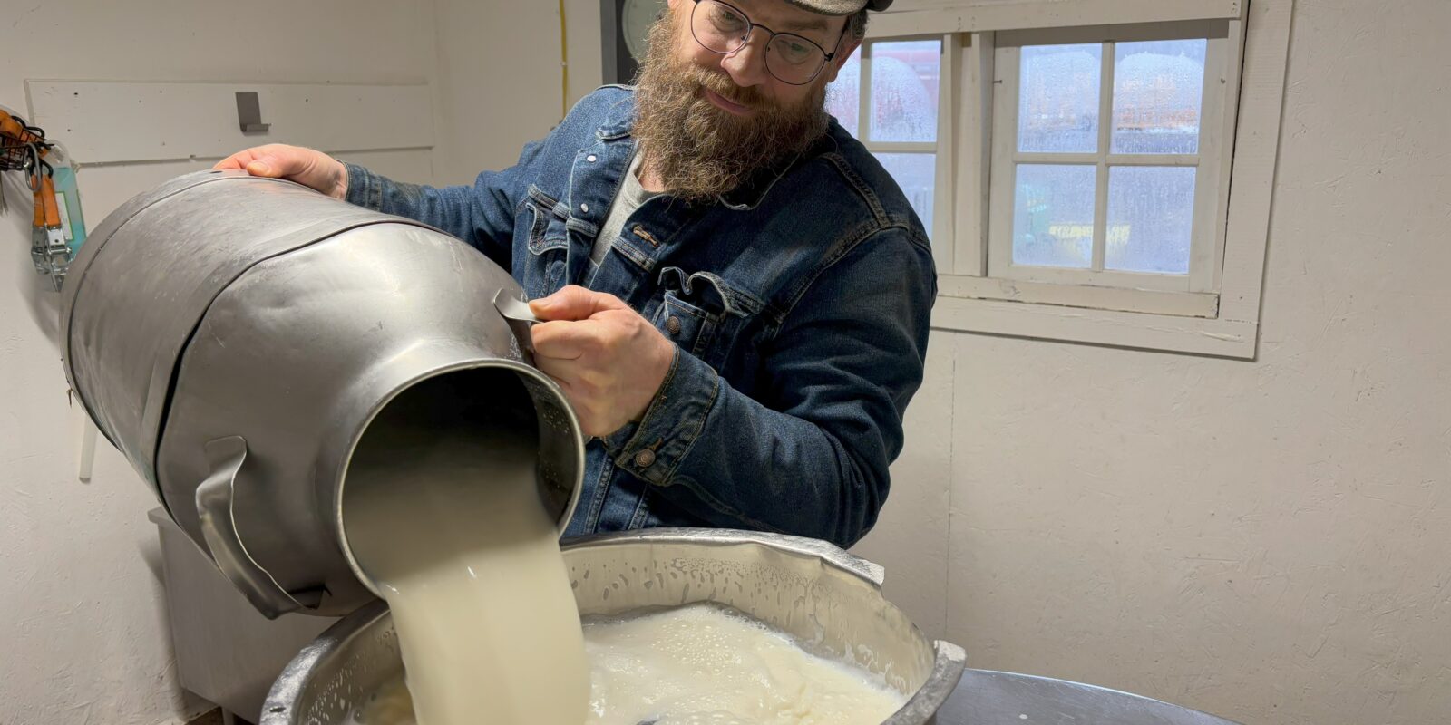 A person making cheese