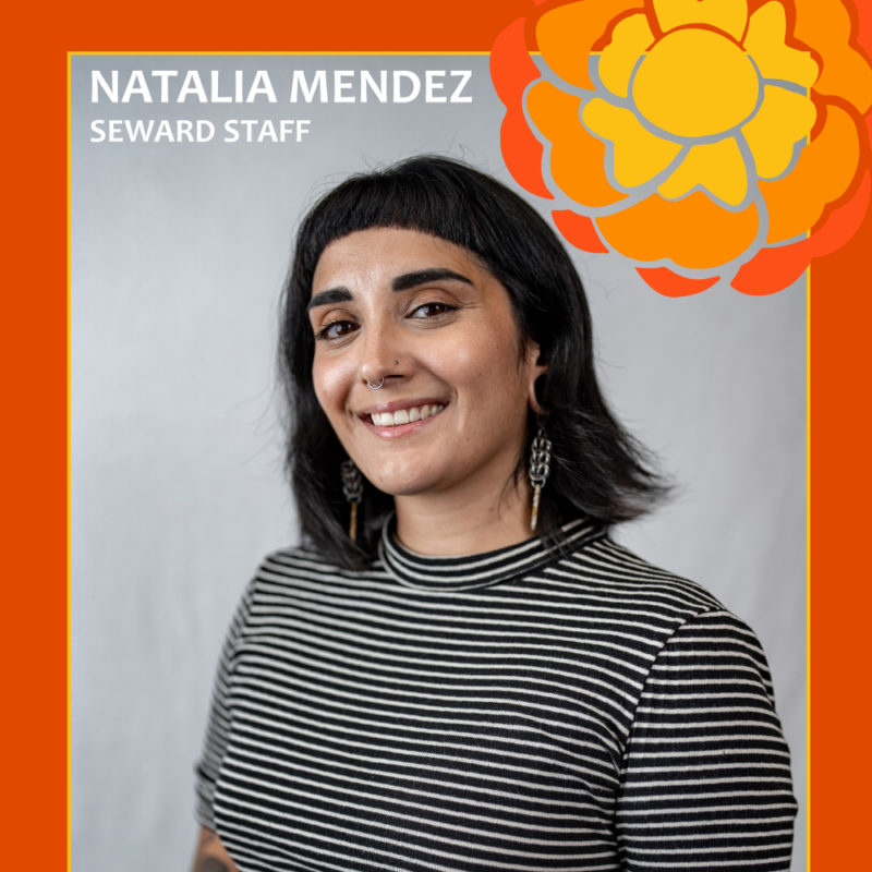 A person smiling in front of a gray background with text reading "Natalia Mendez, Seward Staff"