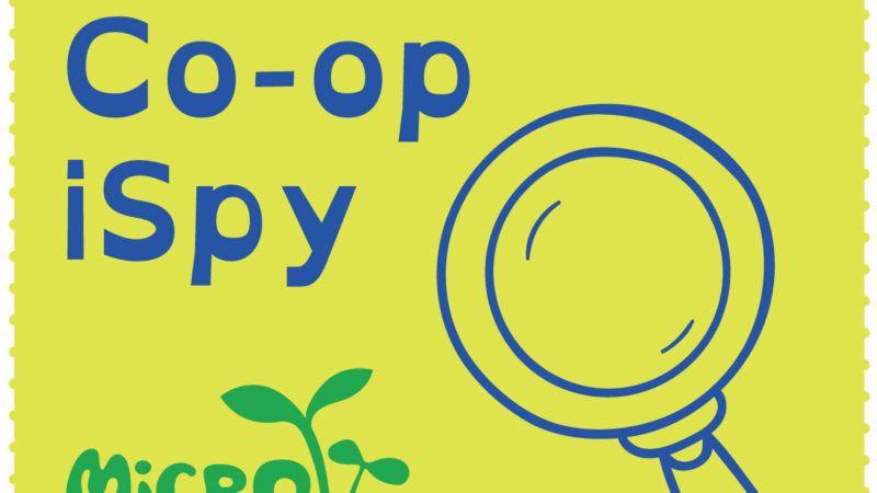 A graphic with an illustration of a magnifying glass that reads "Microgreens Seward Co-op iSpy"