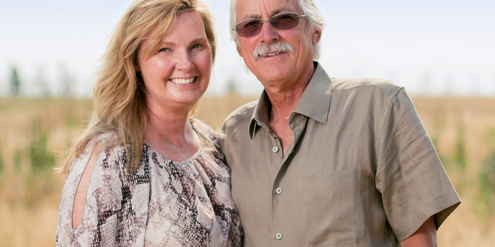 two people in front of herb field