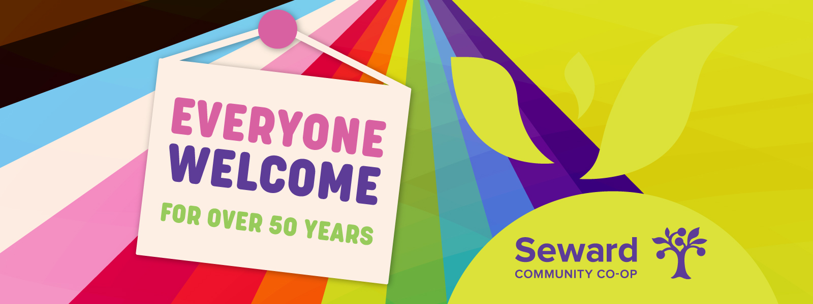 A rainbow with a sign overlay that reads "Everyone Welcome for Over 50 Years"