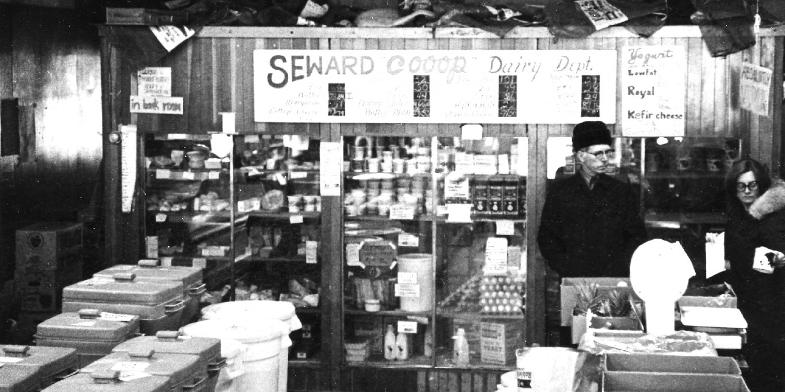 black and white image of 1970s Seward Co-op dairy department