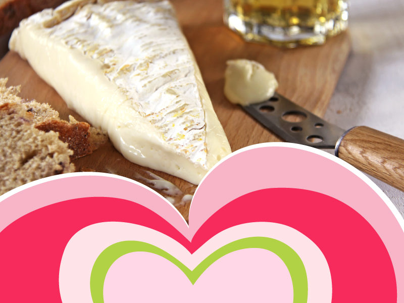 A picture of cheese with a heart graphic overlay