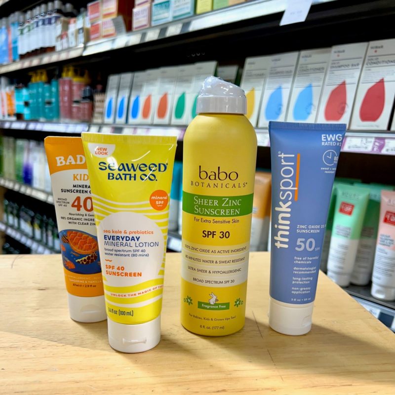 A variety of sunscreens on a table