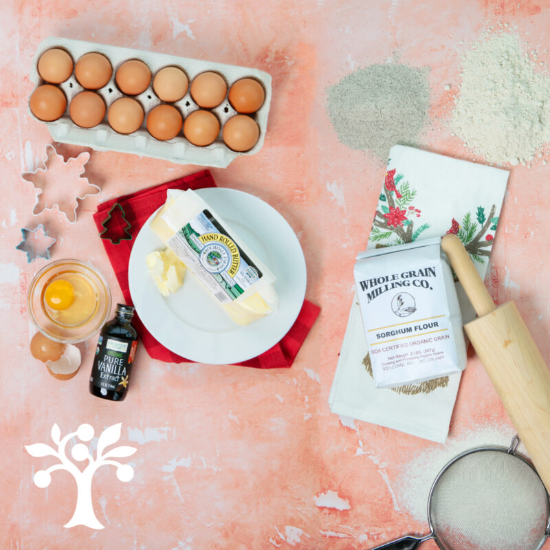 A variety of baking staples on a pink background