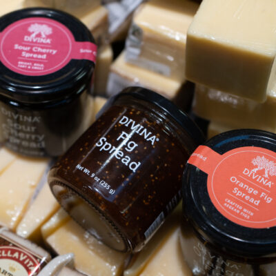 Three jars of Divia spreads on top of cheese