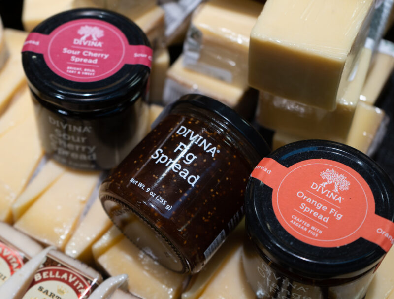 Three jars of Divia spreads on top of cheese