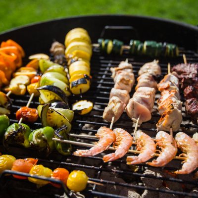 A variety of items on an outdoor grill
