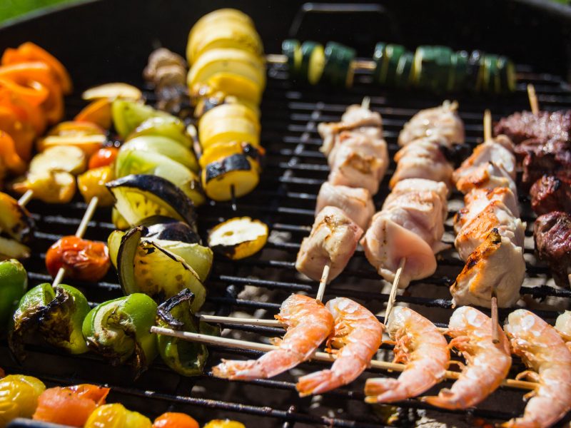 A variety of items on an outdoor grill