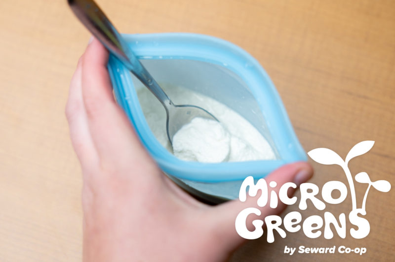 Ice cream in a blue bag with text overlay reading "Microgreens"