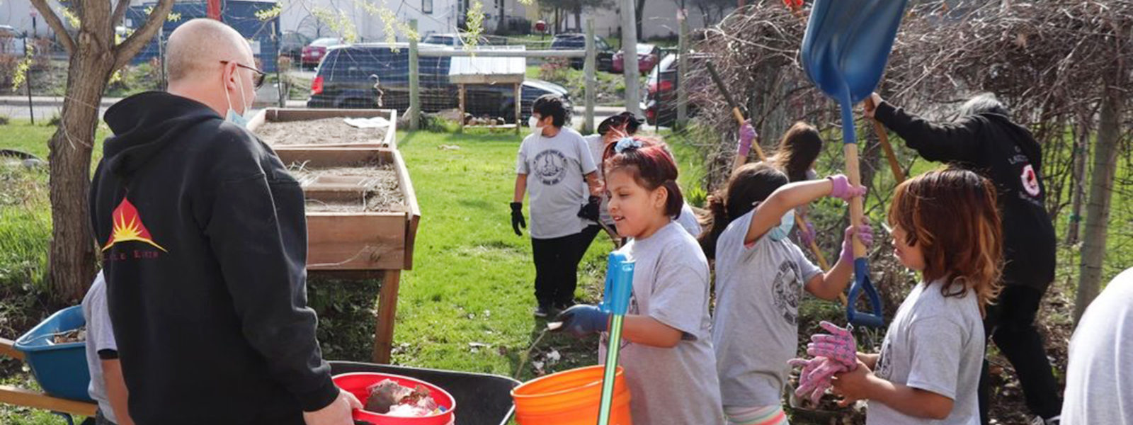 A group of children helping on a farm