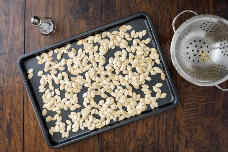 Pumpkin seeds on a roasting pan